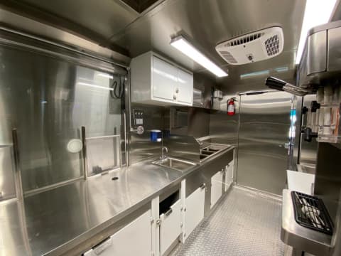 Fan, fire extinguisher, and lamp configuration