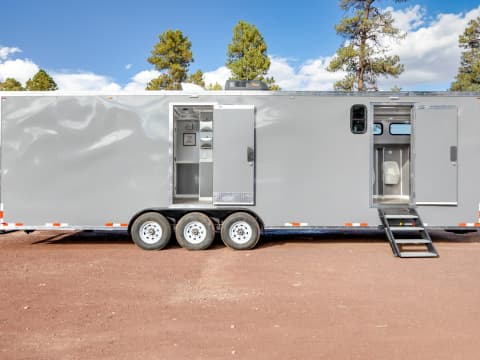 Portable toilet trailer with shower