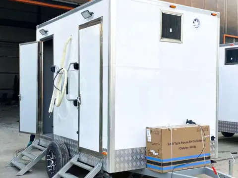 Portable toilet with fan and lighting